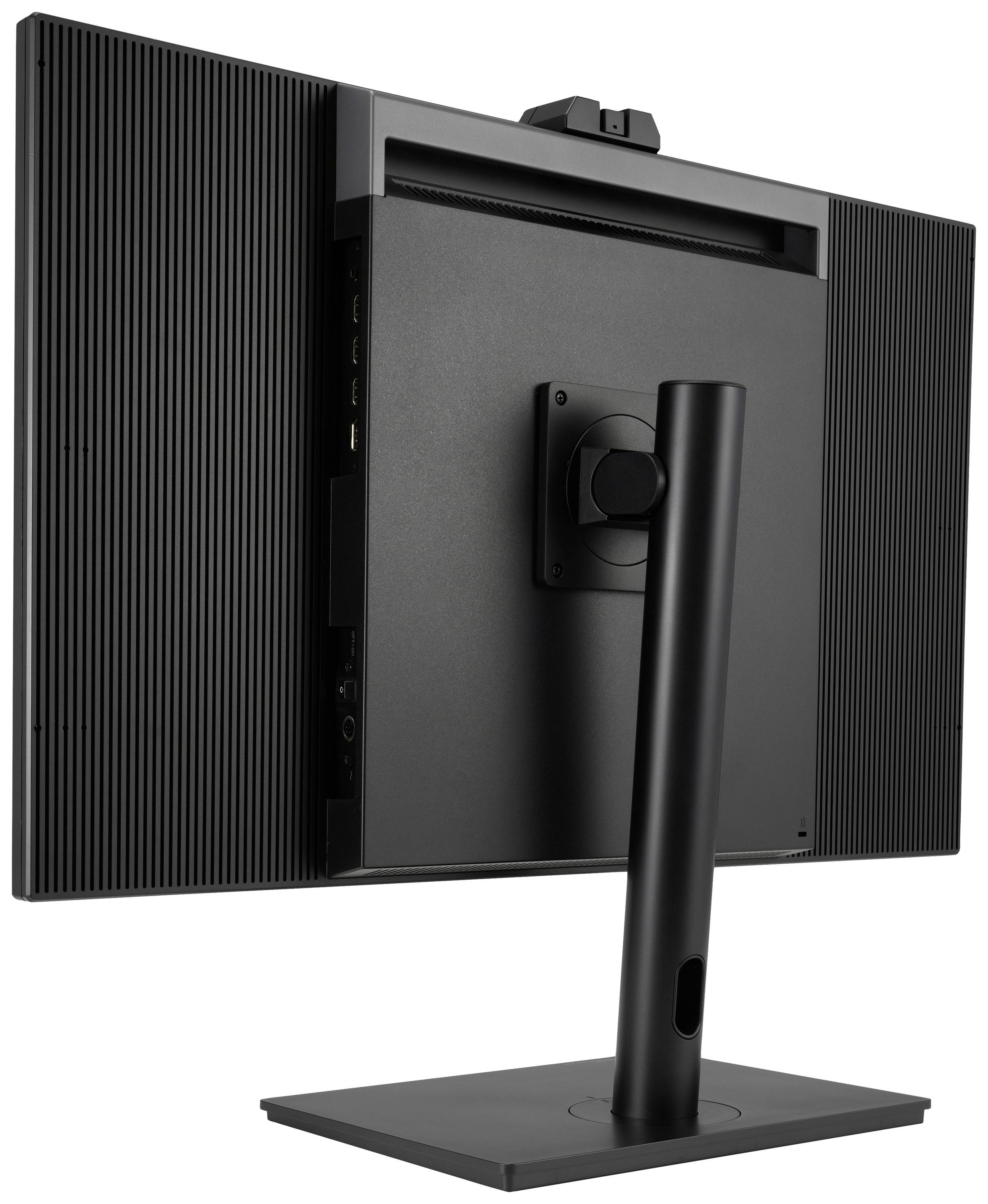 Achteraanzicht van een zwarte computermonitor met een rechthoekige voet en een draaibaar scharnier, waarbij de aansluitingen aan de zijkant zichtbaar zijn.