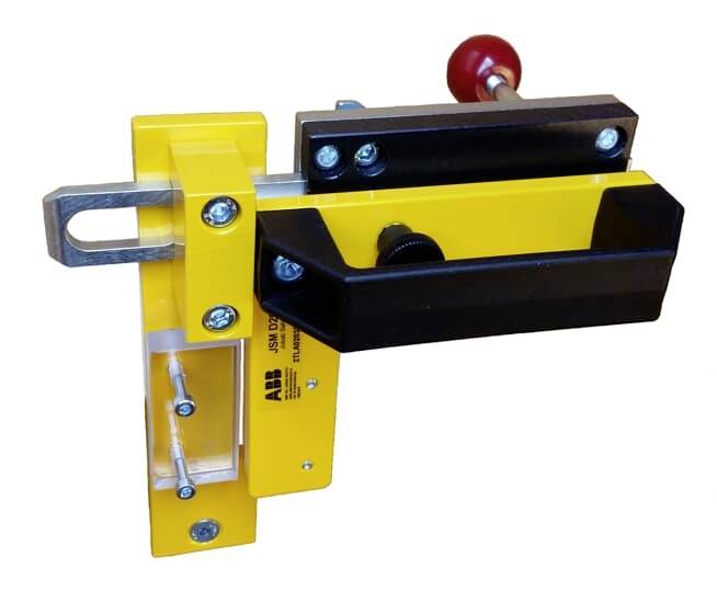 Geel en zwart mechanisch apparaat met handgreep en metalen schroeven, vermoedelijk een klemSystemeem voor industriële toepassingen.