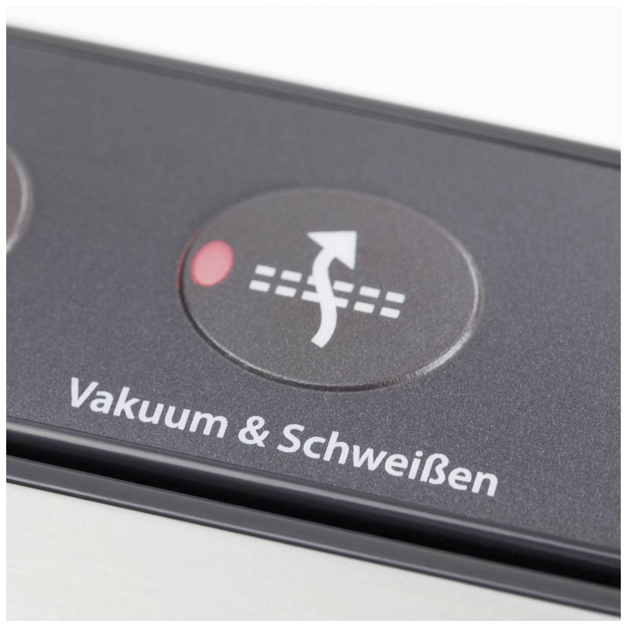 Close-up van een knop met het opschrift 'Vacuüm & Lassen'. Een rood lampje geeft activiteit of een startproces aan.