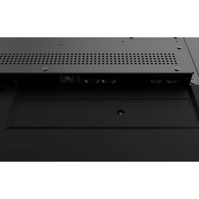 Achterkant van een elektronisch apparaat met meerdere aansluitingen, waaronder een Ethernet-poort. Oppervlakken met sleuven voor ventilatie.