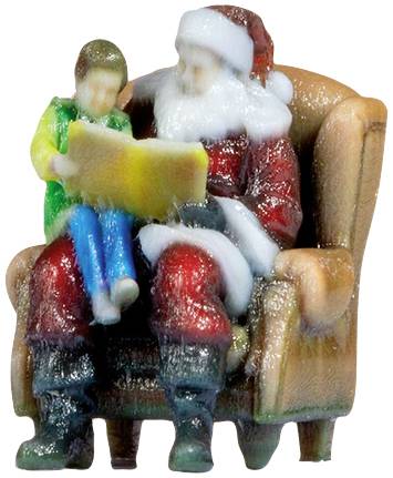 Kerstman zit met een kind op zijn schoot en leest samen een boek.