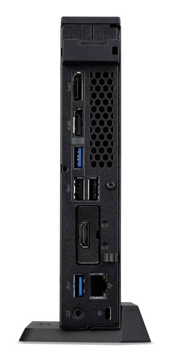 Een mini-pc met meerdere aansluitingen, waaronder HDMI, USB en Ethernet, rechtop staand op een kleine standaard.