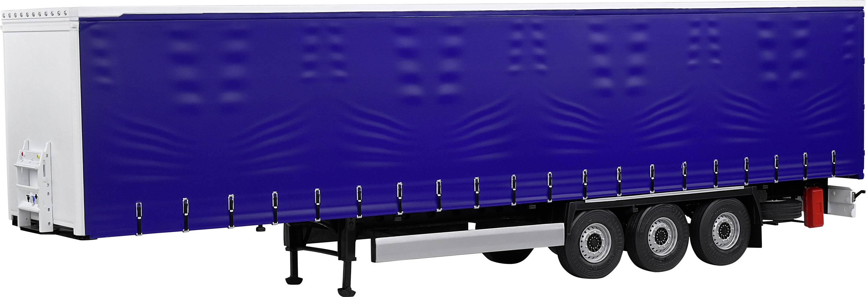 Een blauwe vrachtwagen-aanhanger met zeildoek, geparkeerd. Drie wielen zichtbaar, stabiel onderstel. Ideaal voor goederenvervoer.