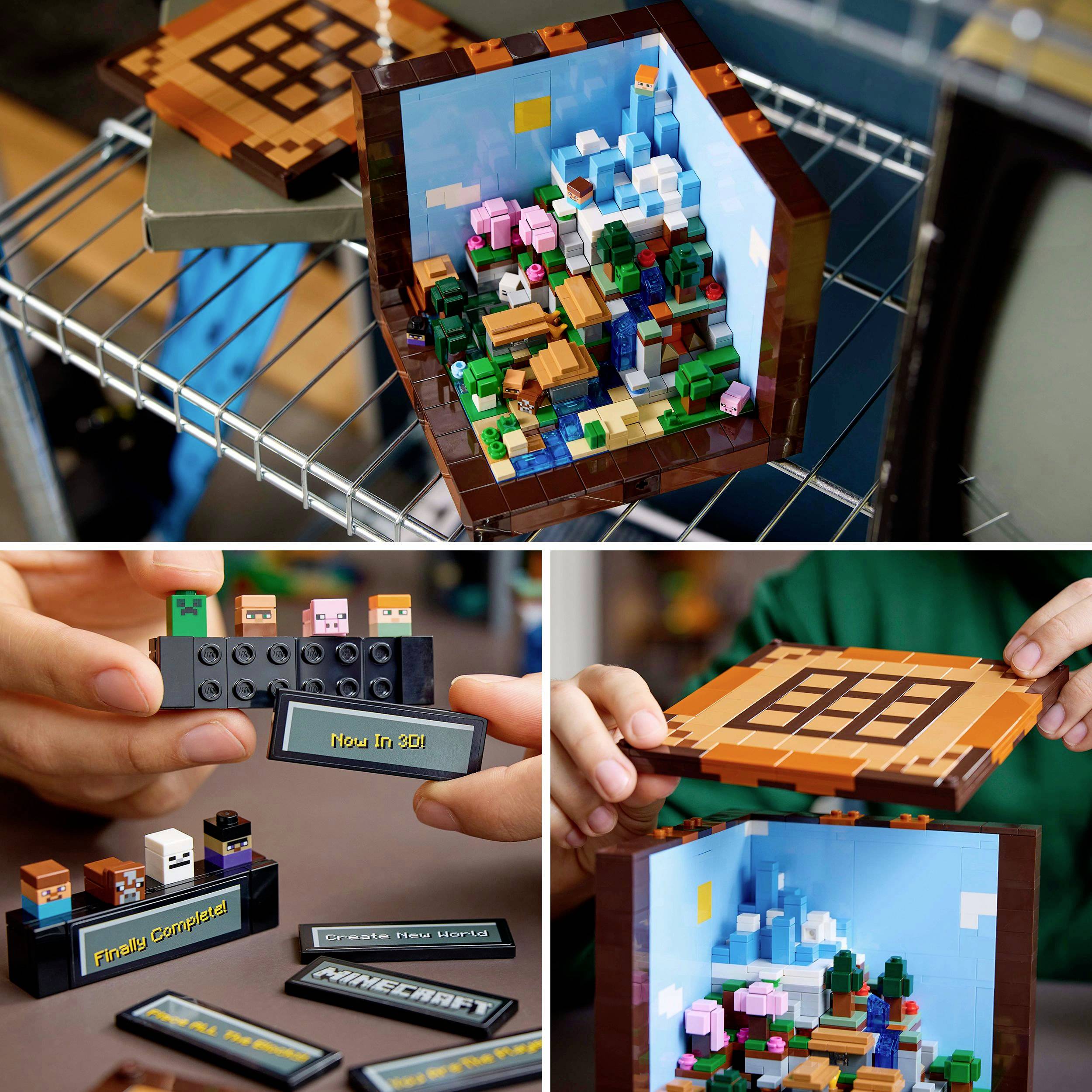 Twee handen wijzen naar twee Lego-diorama's van Minecraft: een 3D-constructie met landschap en miniatuurfiguren, tentoongesteld op een tafel.