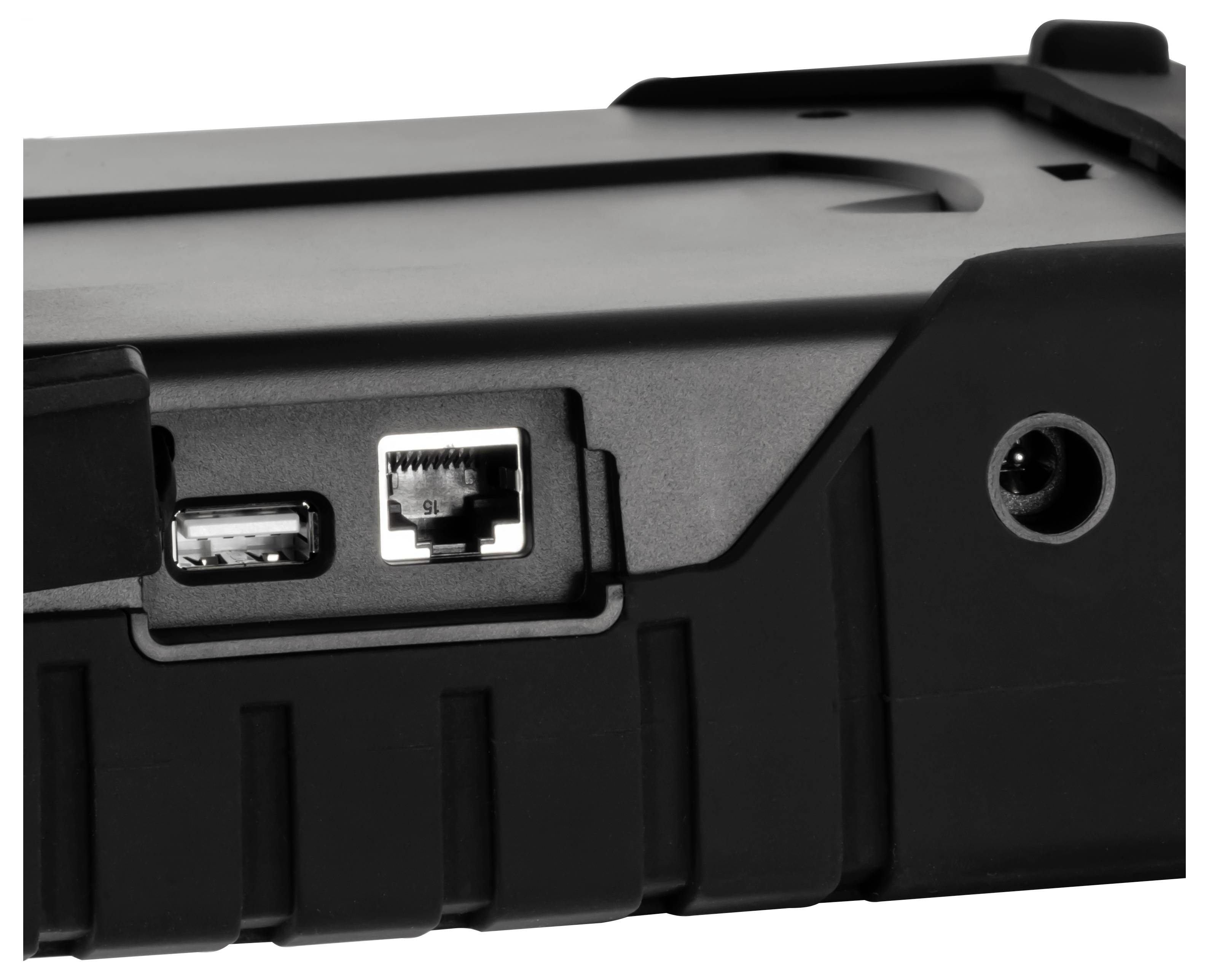Close-up van een zwart apparaat met aan de zijkant een USB-poort, Ethernet-poort en een ronde voedingsstekker.