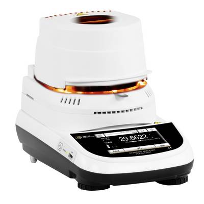 Laboratoriumanalysator met witte behuizing en zwart aanraakscherm, met een verwarmde steekproefkamer en digitale display.
