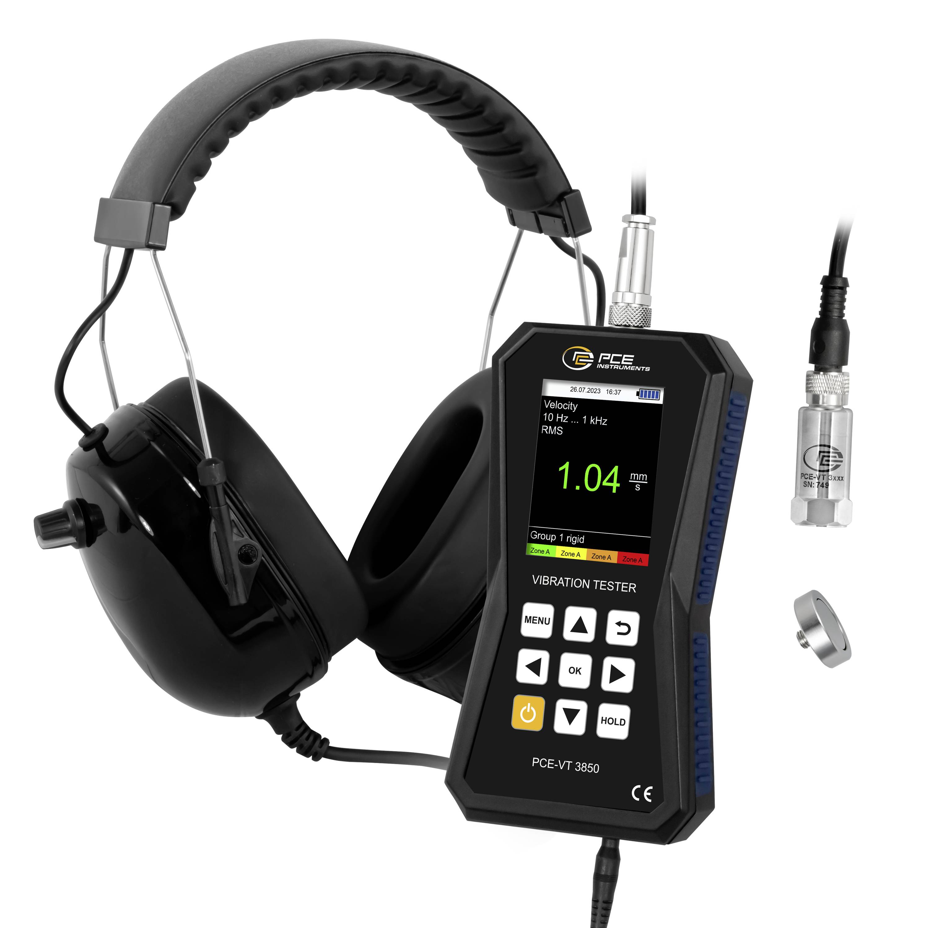 Trillingsvermogen met over-ear koptelefoon en digitaal display met 1.04 mm/s, plus twee sensorsondes en een montageringel.