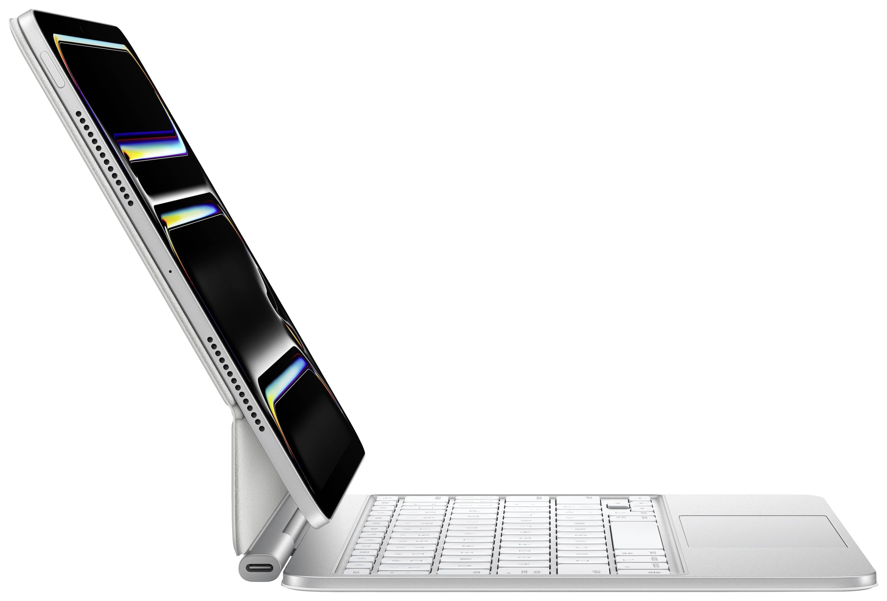 Een slanke, moderne laptop met een afneembaar scherm in zijaanzicht, dat op een magnetisch toetsenbord-dock staat.