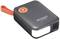 Draagbare zwarte powerbank met oranje draagriem en geïntegreerde LED-verlichting. Merknaam "VOLTCRAFT" op het oppervlak.