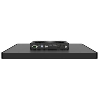 Achterkant van een elektronisch apparaat met meerdere aansluitingen: HDMI, USB, Ethernet en stroomaansluiting op een zwart oppervlak.