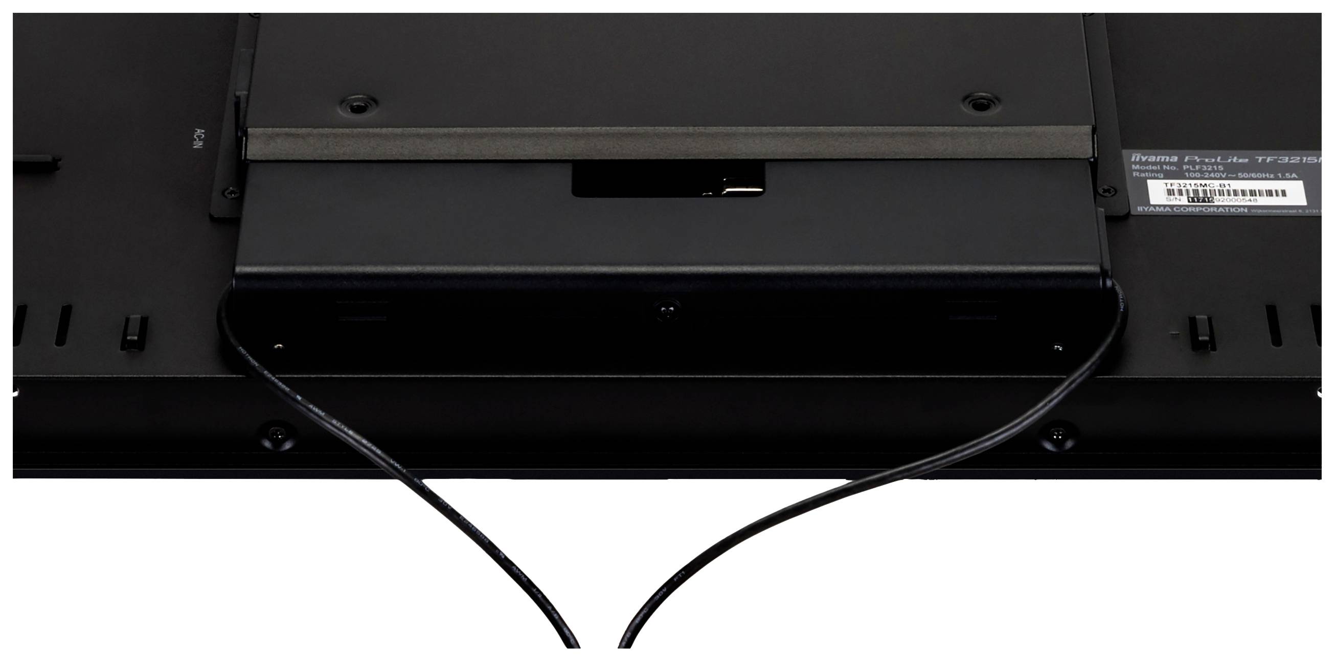 Achterzijde van een monitorbehuizing met open kabelaansluiting. Twee kabels lopen van de aansluiting naar beneden.