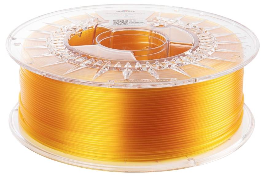 Een transparante kunststof spoel met oranje 3D-printer-filament. Het heeft een gelijkmatig wikkelmotief en een heldere, heldere kleur.