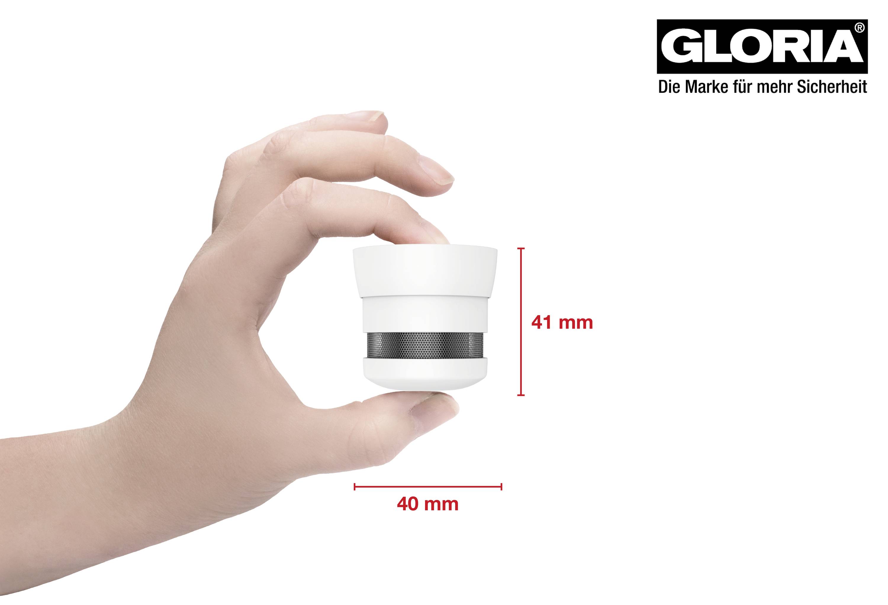Hand houdt een compacte rookmelder vast van 41 mm hoogte en 40 mm diameter, met het merkenlogo 'Gloria' rechtsboven.