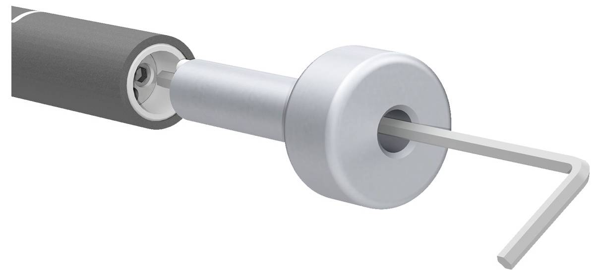 Een gereedschap dat een cilindrisch onderdeel vastdraait met een inbussleutel, ter illustratie van een mechanisch assemblageproces.