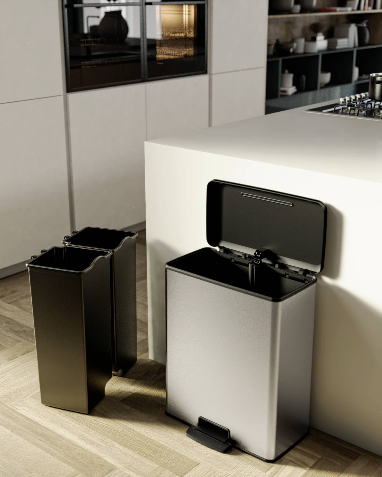 Een geopende vuilnisemmer van roestvrij staal in een moderne keuken, naast twee uitneembare bakken voor afvalscheiding.