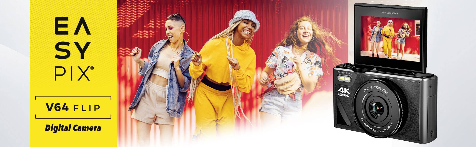 Easypix V64 Flip Digitale camera toont drie vrolijke personen op het scherm voor een rode achtergrond. Tekst 'EASYPIX V64 FLIP'.