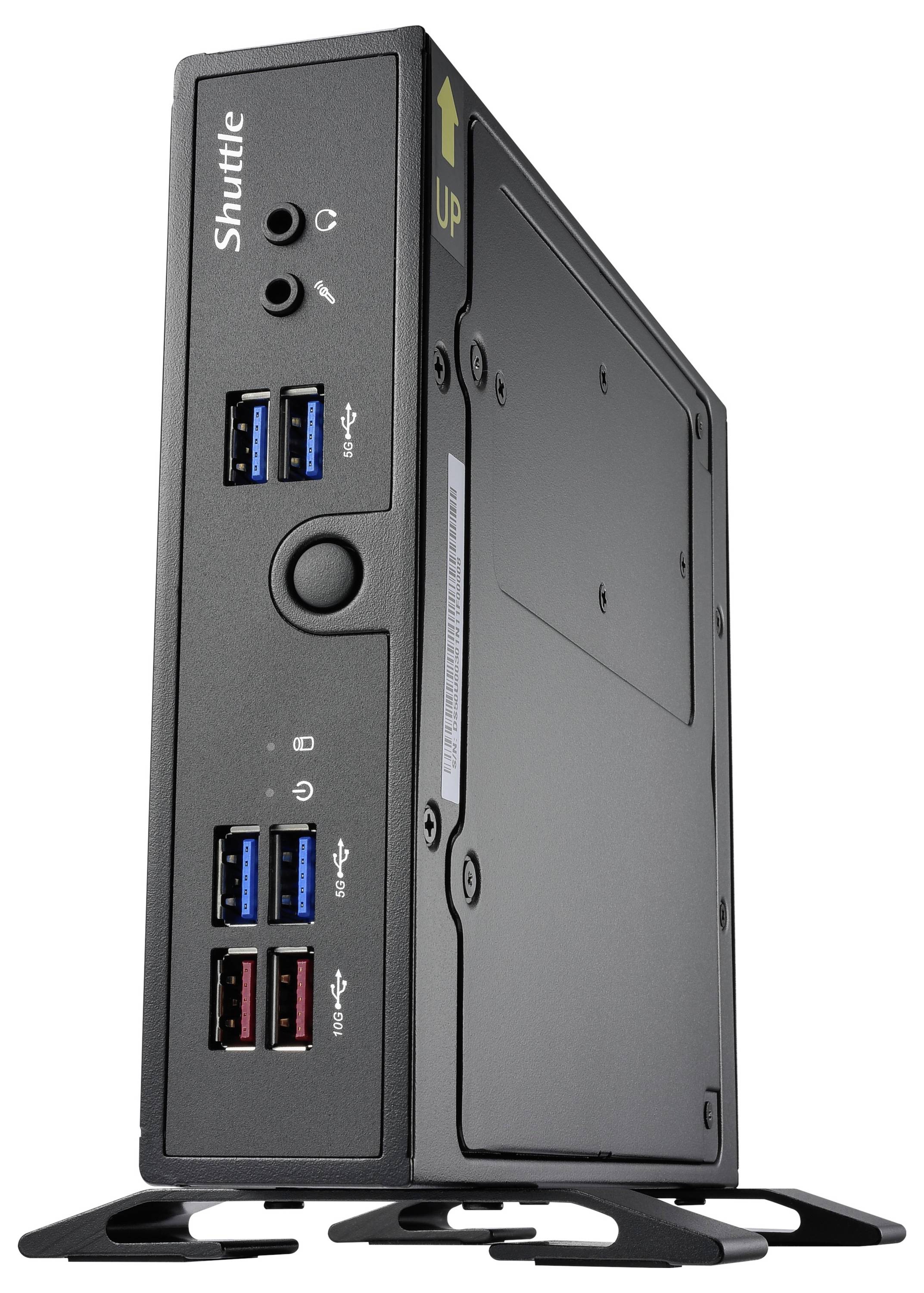 Kleine zwarte computer in staande positie, met USB-poorten en audiojacks aan de voorkant. Merk 'Shuttle' en 'UP'-pijl op de bovenkant.