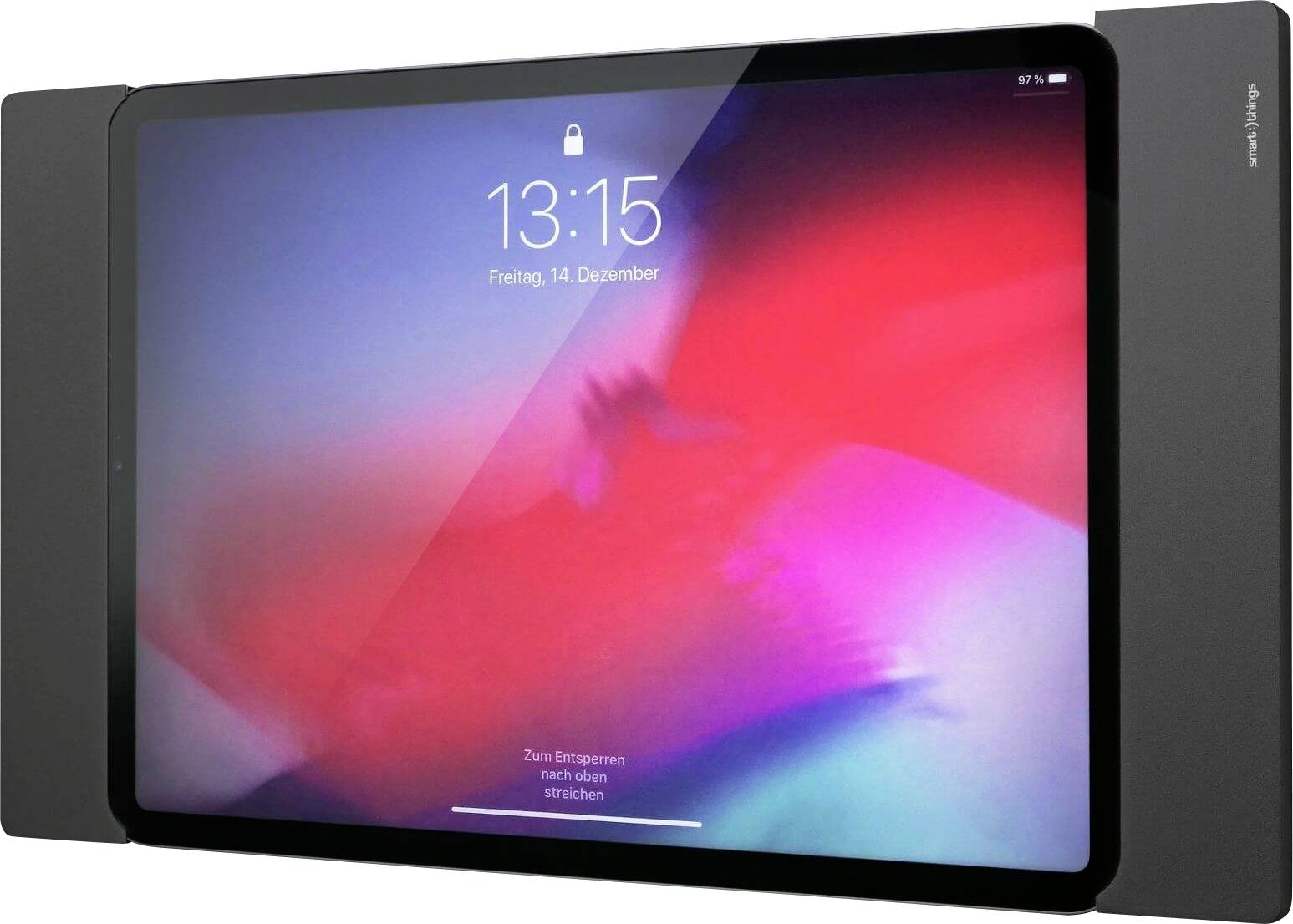 Tablet met tijd- en datumweergave op het scherm, toont 13:15 uur op vrijdag, 14 december. Wazig, kleurrijk achtergrond.