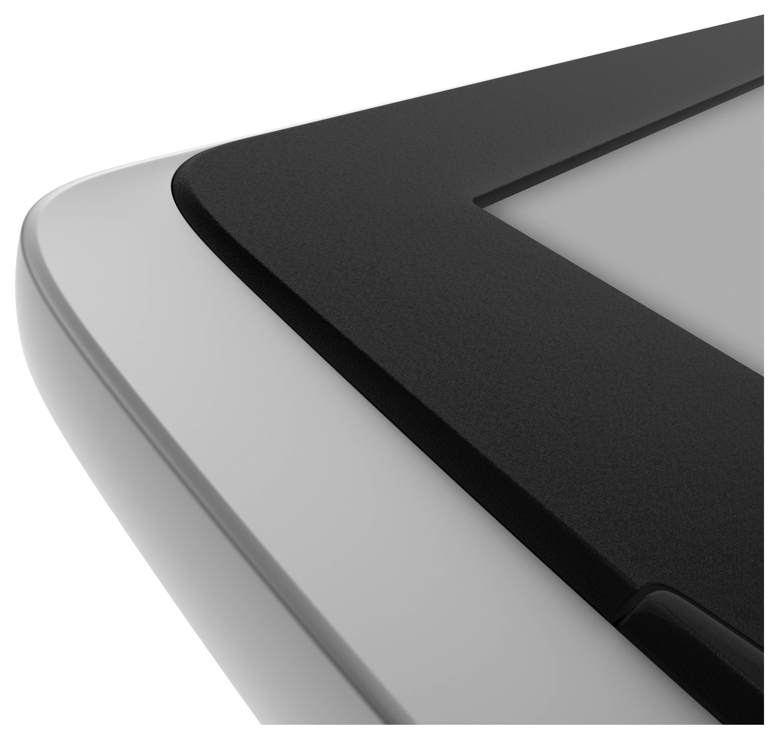 Close-up van een tablet-hoek die het afgeronde ontwerp en het oppervlak laat zien. Geen zichtbare logo's of tekens.