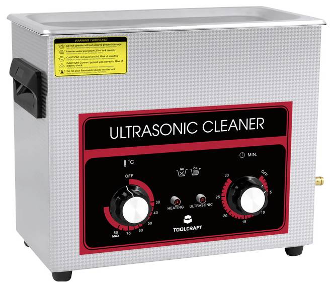 'Ultrasoonreiniger met temperatuur- en tijdinstellingen, zijdelingse handgrepen en waarschuwing bovenaan. Geschikt voor reinigingstoepassingen.'