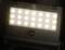 'LED-schijnwerper met bewegingsmelder' op zwarte achtergrond. 24 helderwitte LED's. Merk 'brennenstuhl' bovenaan zichtbaar.