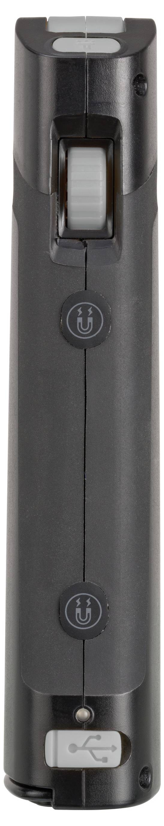 Close-up van een zwart handheld-apparaat met een groot centraal wiel, twee ronde knoppen en een USB-poort aan de onderkant.
