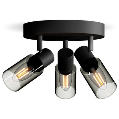 Drievoudige plafondspot met zwarte fittingen en transparante glazen kappen, die warm oplichten. Ideaal voor moderne interieurs.
