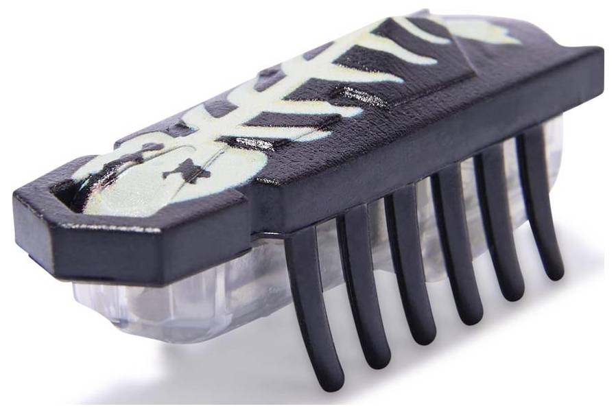 Een klein, zwart, zeshoekig speeltje met een beschilderd, skeletachtig oppervlak en zes flexibele poten om mee te bewegen.