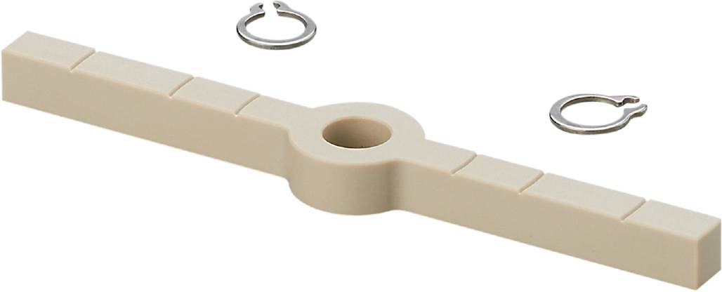 'Beige kunststof houder met ronde sleuf, naast een zilveren ring met opening.'