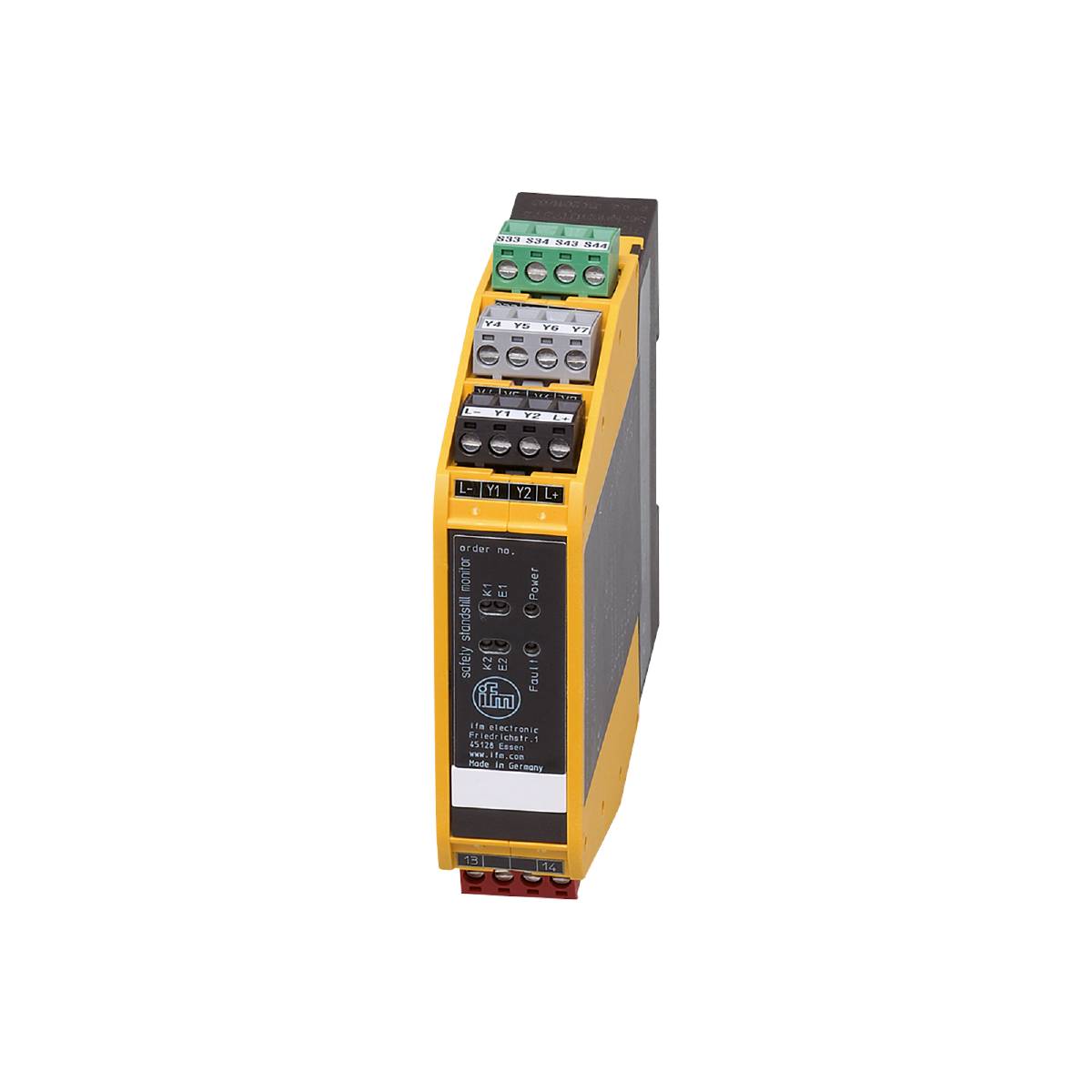 Een geel automatiseringsapparaat met meerdere aansluitklemmen en een schakelaar, tegen een zwarte achtergrond.