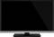 Een moderne flatscreen-televisie met een zwarte rand op een rechthoekige standaard, scherm uitgeschakeld.