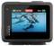 GoPro-camera-display toont video-opname van spelende dolfijnen in helder blauw water. Batterijindicator op 100%, opnametijd 00:01.