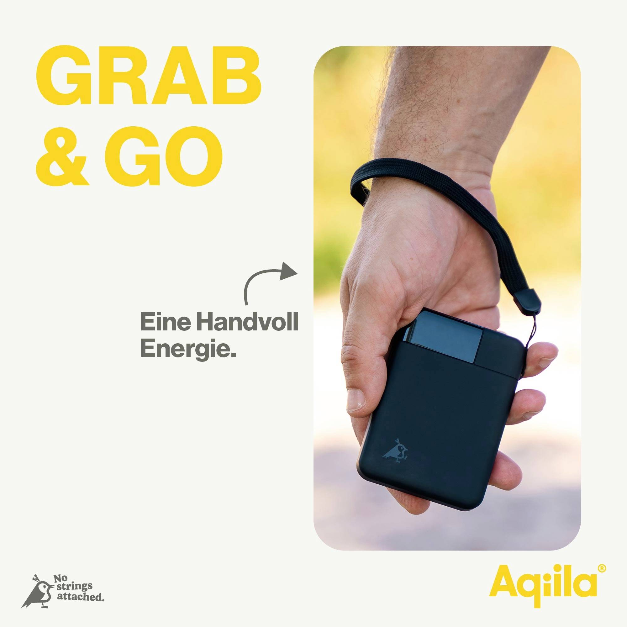 Een hand grijpt een slanke, draagbare powerbank met tekst: 'GRAB & GO' en 'Een handvol energie.'