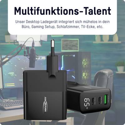 Multifunctionele oplader in zwart design, op een bureau in een modern ingerichte ruimte met beeldscherm en gaming-setup.