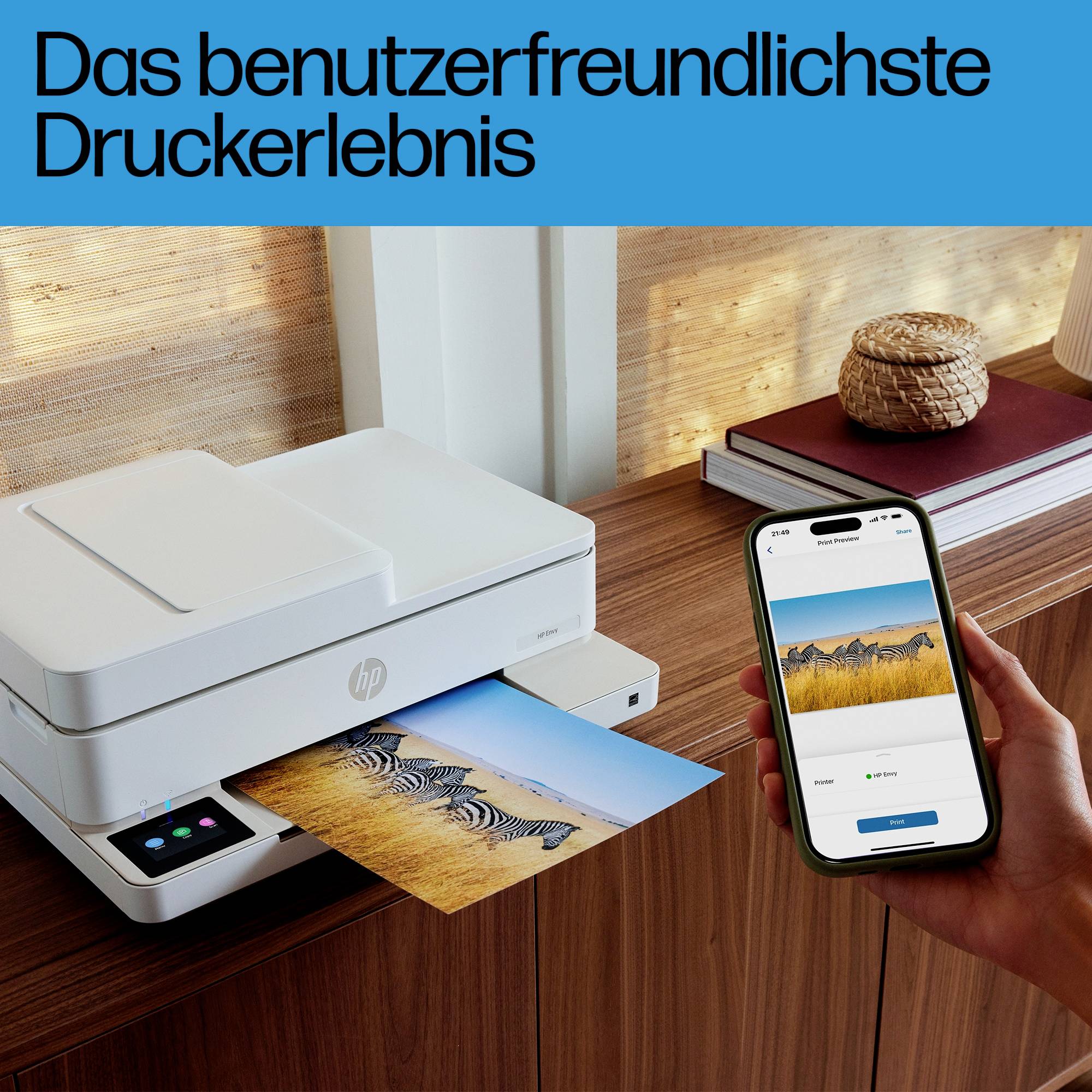 Een printer drukt een foto van zebra's af. Naast de printer houdt een hand een smartphone met een afdrukvoorbeeld. Tekst bovenaan: 'De meest gebruiksvriendelijke printervaring'.