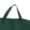 Groene stoffen tas met stevige draaghendels, close-up van het bovenste gedeelte.