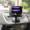 Een DAB-autoradio in de scanmodus toont 'DAB Scanning' en 'Stations Found: 7' op een display, gemonteerd op een dashboard.