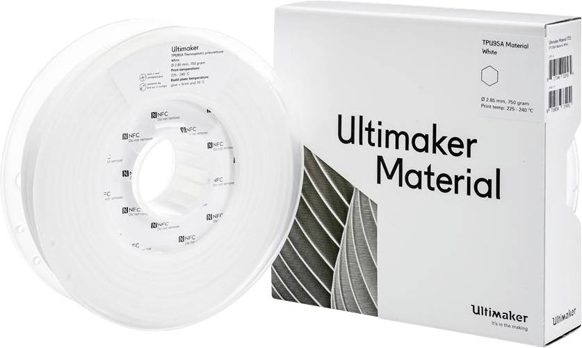 Een doos met het opschrift 'Ultimaker Material' naast een witte filamentspoel voor een 3D-printer.