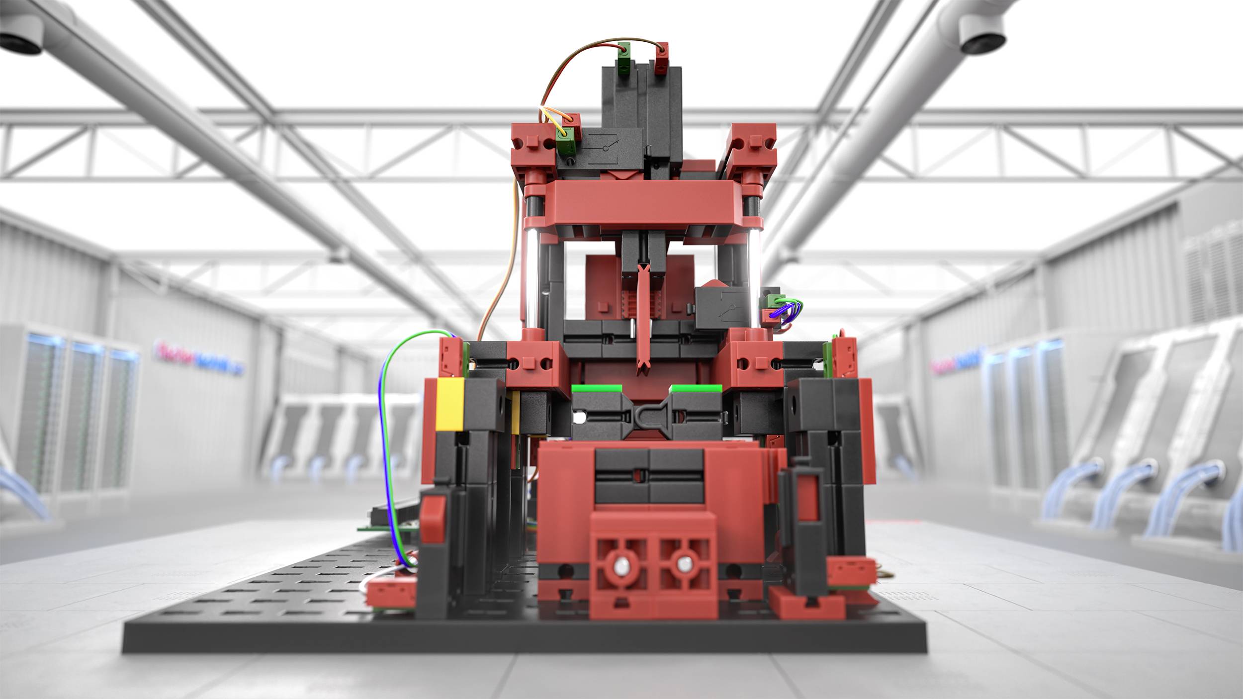 Industriële robotconstructie gemaakt van rode en zwarte bouwstenen op een grijze ondergrond in een fabrieksomgeving.