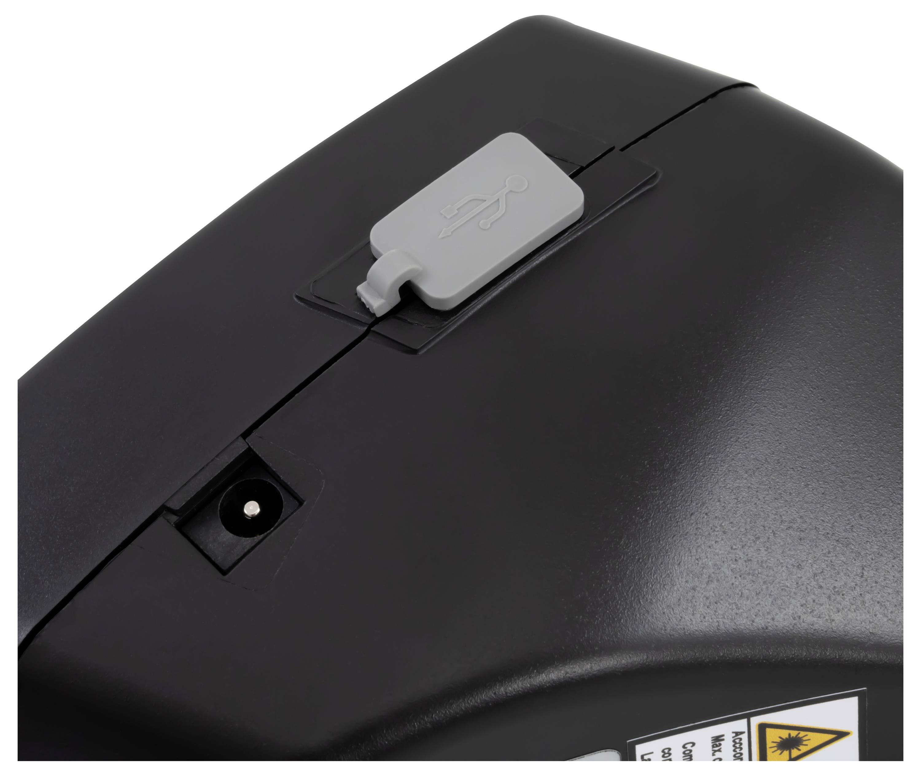 Close-up van een zwart apparaat of printerpaneel met een grijze USB-afdekking/-grendel bovenop en een kleine ingebouwde poort eronder.