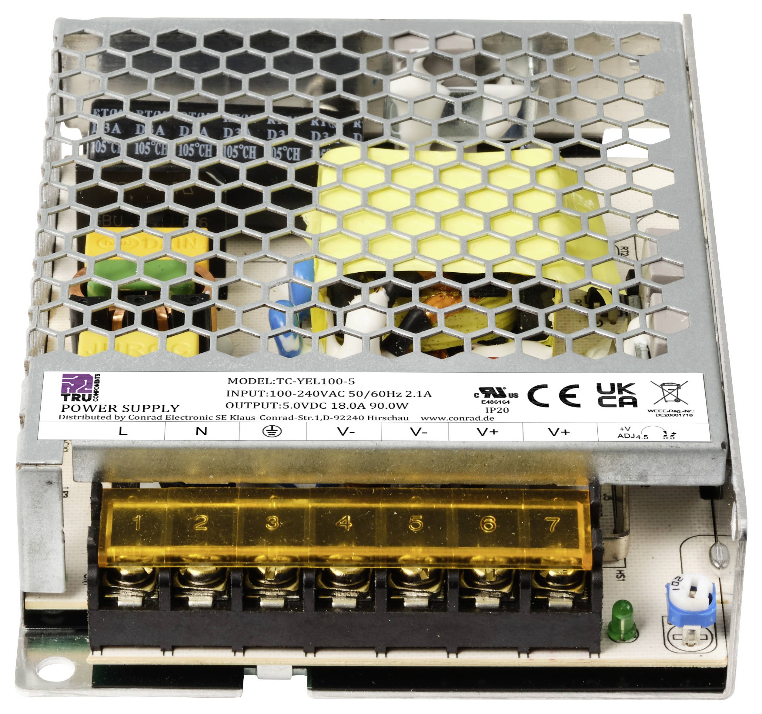 Voeding met metalen rooster afdekking, toont aansluitklemmen en specificaties: Ingang 100-240VAC, Uitgang 12VDC 10A.