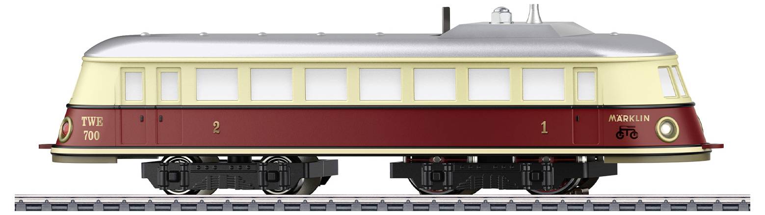 Een modeltrein met een crèmekleurig dak en een bordeauxrode onderkant staat op de rails. Aan de zijkant zijn de nummers '2' en '1' zichtbaar.