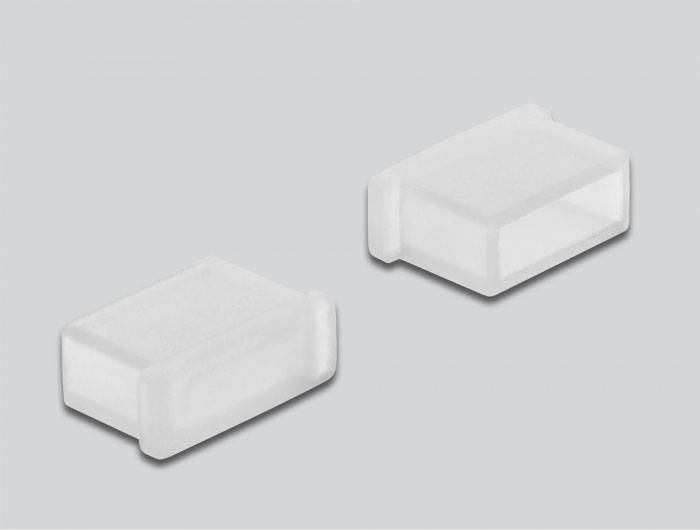 Twee rechthoekige, transparante plastic deksels naast elkaar op een grijze achtergrond. Ze zijn eenvoudig en functioneel ontworpen.