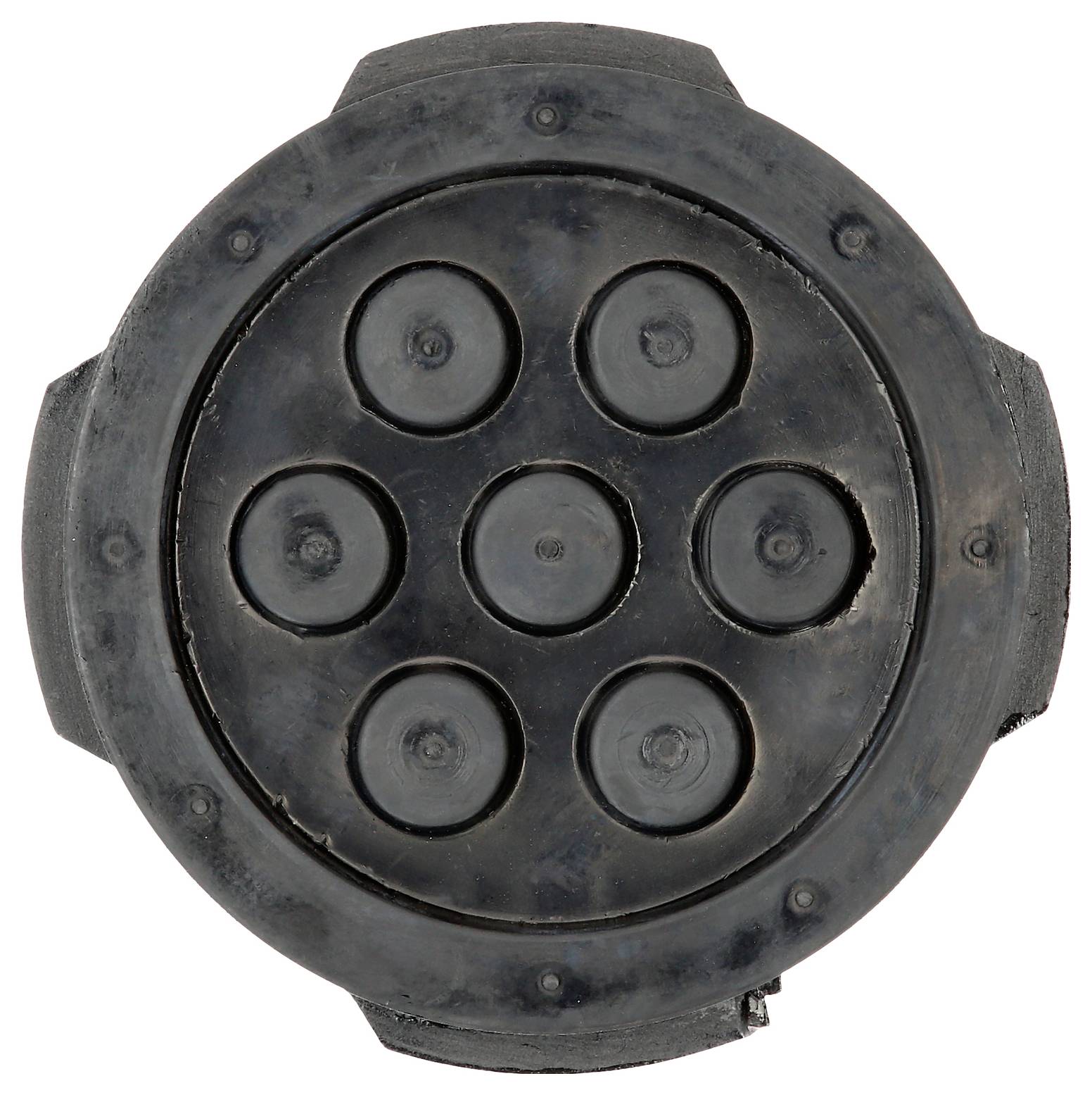 Een zwarte ronde mat met zeven verhoogde cirkels die eruitziet als een onderdeel of component van een groter mechanisme.
