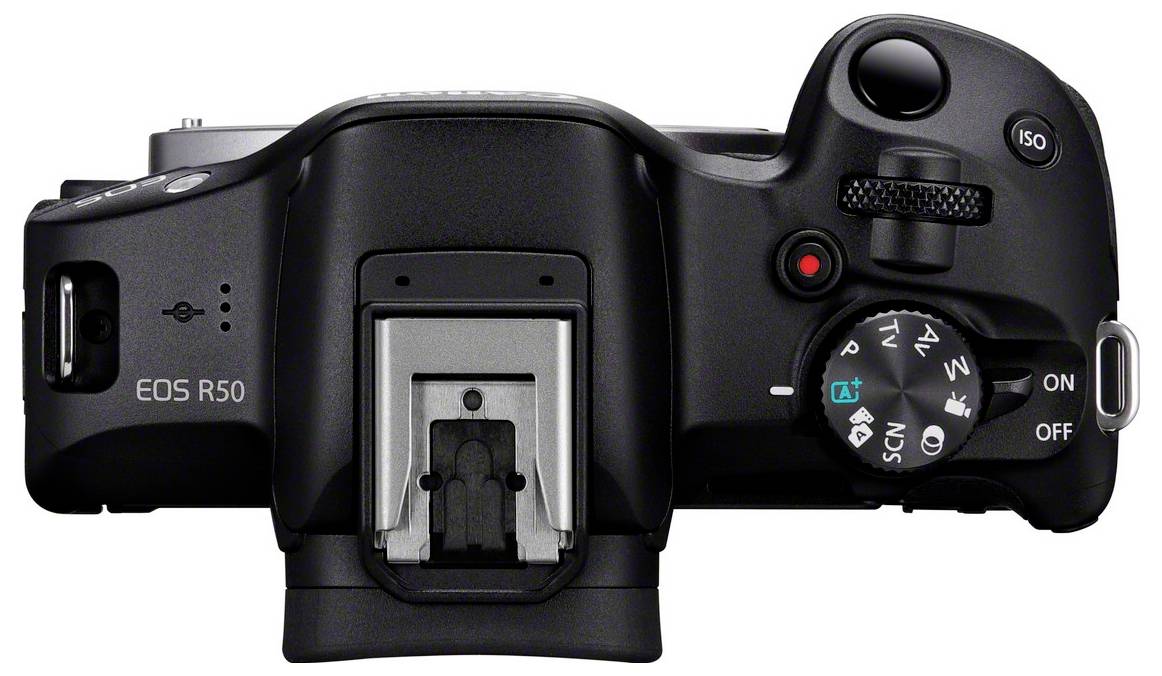 Digitale camera van bovenaf met moduskeuzeknop, sluiterknop en display.