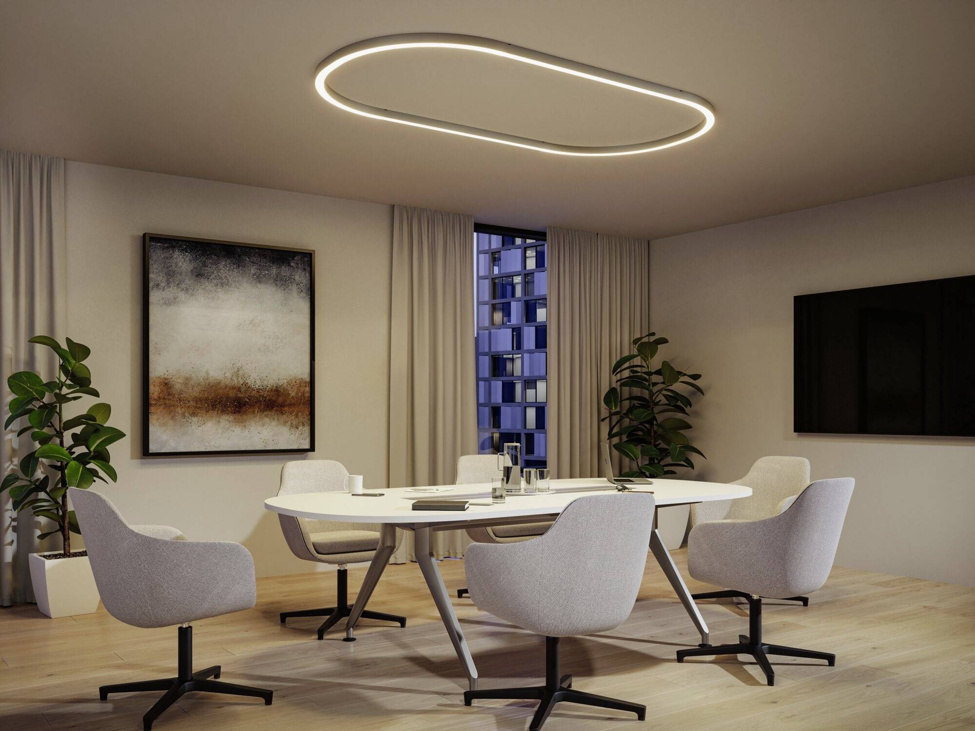 Vergaderzaal met een ovale tafel, zes grijze stoelen, planten en een modern kunstwerk aan de muur, verlicht door een ovale plafondlamp.