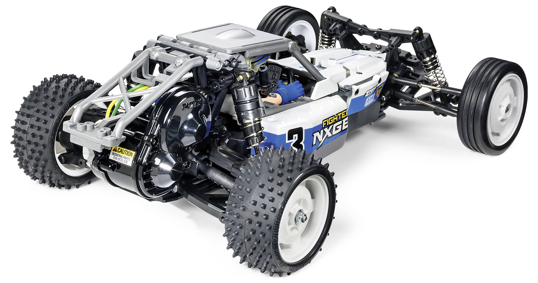 RC-auto gezien van opzij met een blootliggend motorblok, grote terreinbanden en ophanging. Sportief design in blauw en wit.