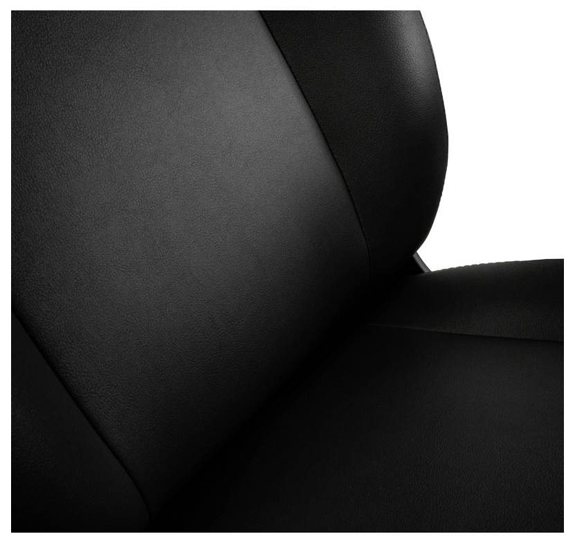 Close-up van een zwarte leren fauteuil, die de fijne textuur en naad van de bekleding toont.