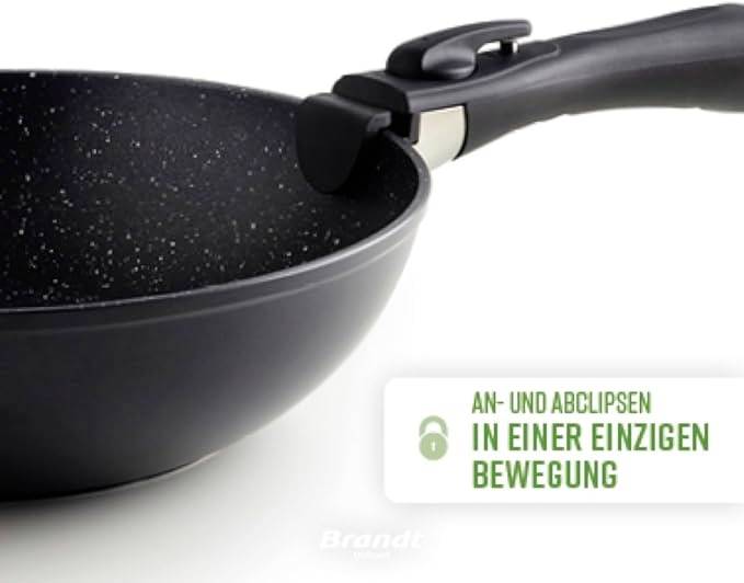 De pan heeft een zwarte, afneembare steel en een anti-aanbaklaag. Tekst op de afbeelding: 'Bevestigen en losmaken in één beweging'.