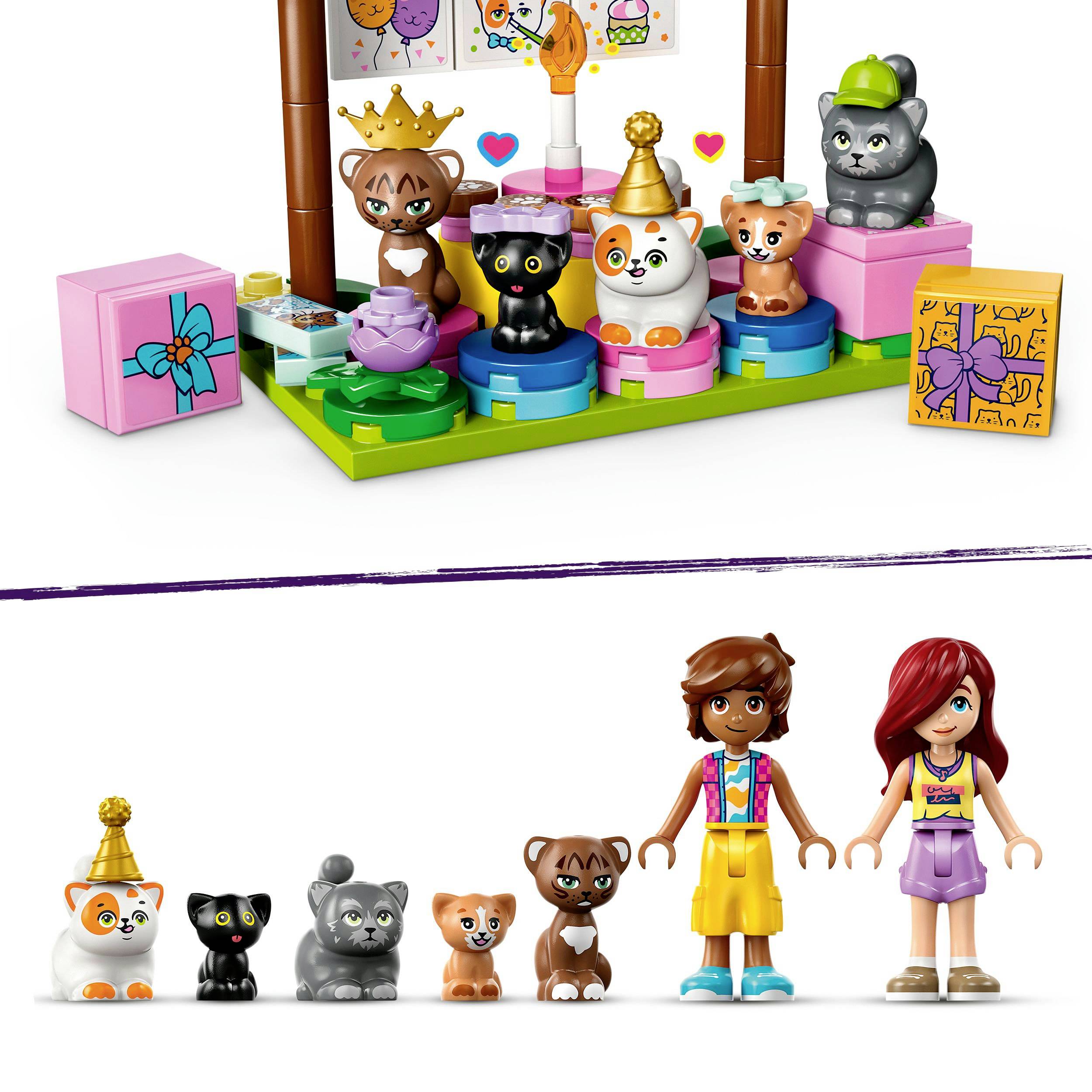 Speelset met dierfiguren en twee poppen. Bovenaan een diorama met dieren, kroon en cadeaus. Onderaan twee poppen en zes dieren op een rij.